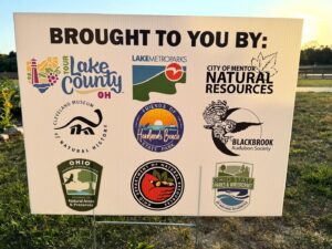 Sign showing the organizations that coordinated the festival